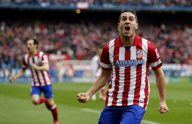 Atletico Madrid's Jorge "Koke" Resurrecion celebrates after scoring a goal against Real Madrid during their Spanish first division soccer match at Vicente Calderon stadium in Madrid March 2, 2014