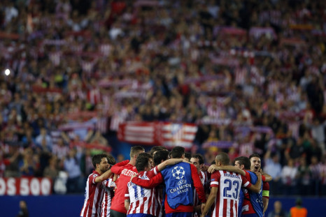 Atletico Madrid players react after winning their Champions League quarter-final second leg soccer match against Barcelona, in Madrid, April 9, 2014.
