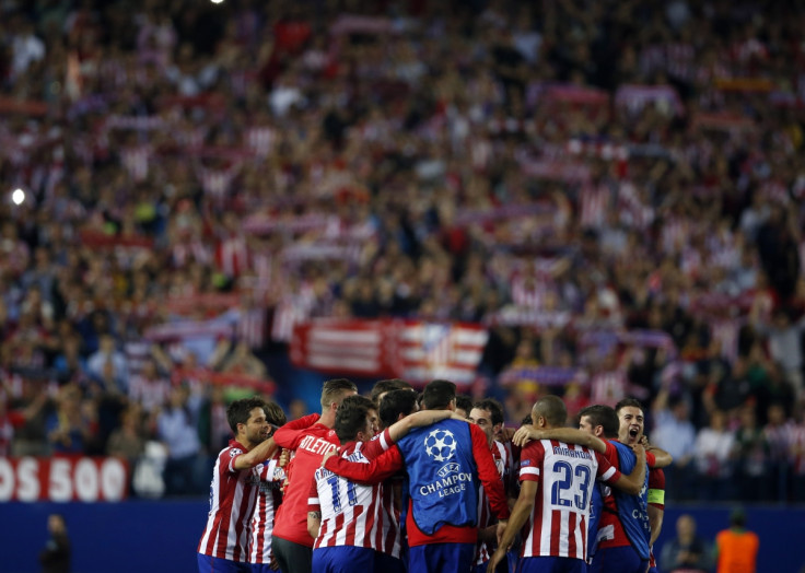 Atletico Madrid players react after winning their Champions League quarter-final second leg soccer match against Barcelona, in Madrid, April 9, 2014.