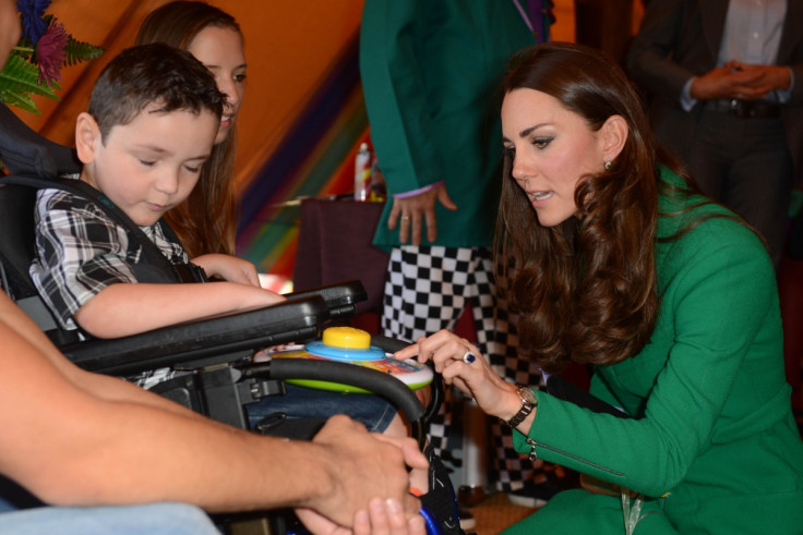 The Duchess of Cambridge chats to one of the children at the Rainbow Hospice