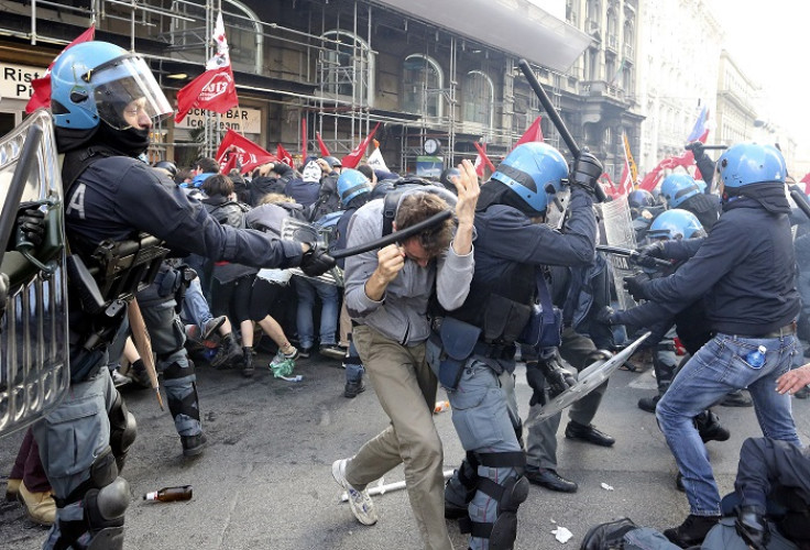 Riot police clash with anti-austerity demonstrators in central Rome.