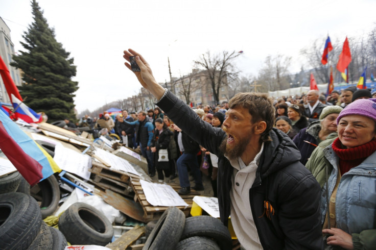 Pro-Russian protesters attend a rally in front of the seized office of the SBU state security service in Luhansk, eastern Ukraine