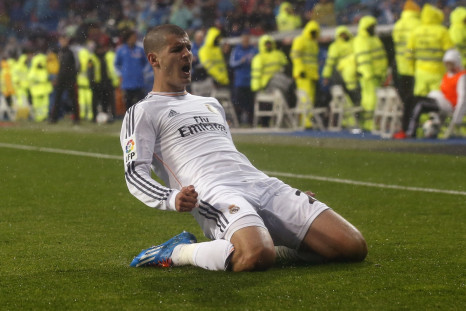 Real Madrid's Alvaro Morata celebrates his goal against Rayo Vallecano during their Spanish First Division soccer match at Santiago Bernabeu stadium in Madrid March 29, 2014.