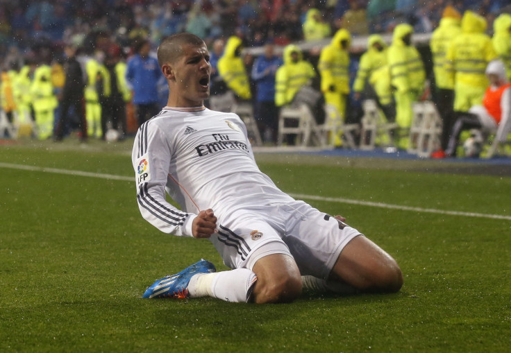 Real Madrid's Alvaro Morata celebrates his goal against Rayo Vallecano during their Spanish First Division soccer match at Santiago Bernabeu stadium in Madrid March 29, 2014.