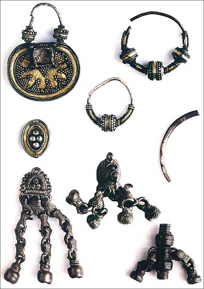 Silver medallions and jewellery found buried with the Siberian mummies