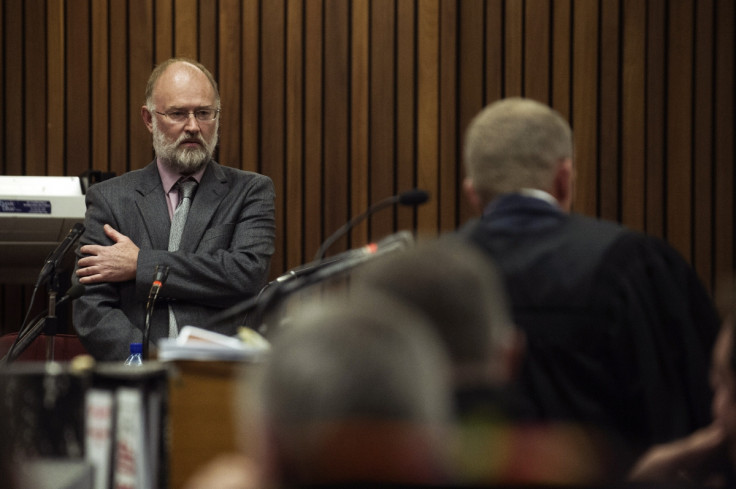 Robert Dixon (left) faces questions from Gerrie Nel during the trial of Oscar Pistorius