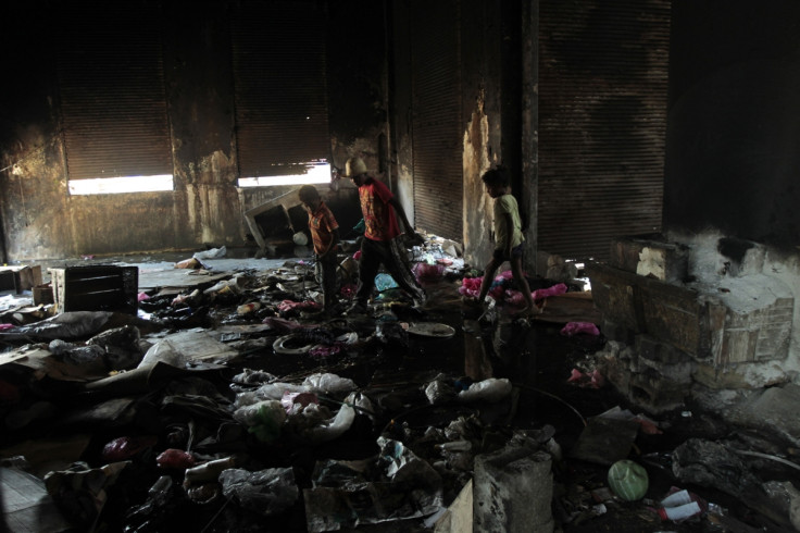 Children search for belongings in a building after President Daniel Ortega declared it unsafe in Managua, following an earthquake on April 15.