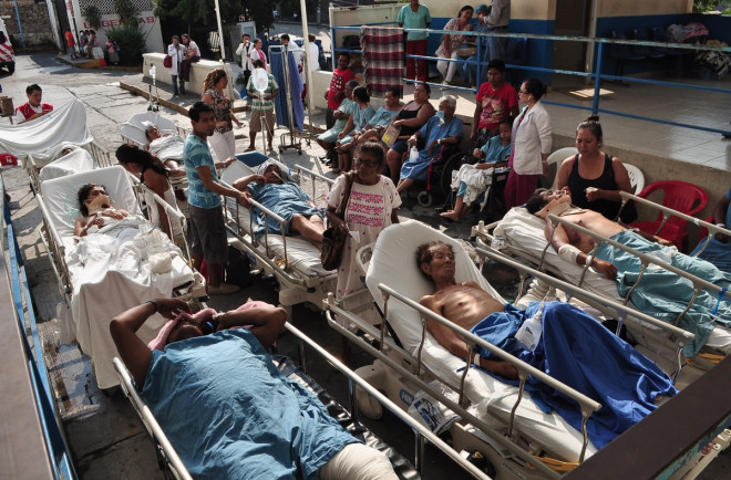 Patients are looked after by their relatives after they were evacuated from a hospital following an earthquake in Acapulco, in Guerrero state, April 18 Patients are looked after by their relatives after they were evacuated from a hospital following an earthquake in Acapulco, in Guerrero state, April 18