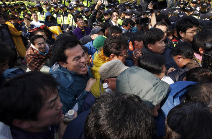 Families of missing ferry victims clash with police on Jindo Island, South Korea.