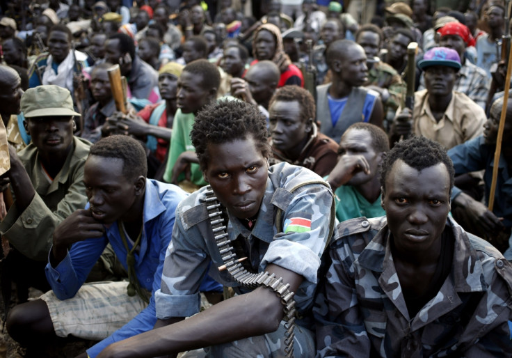 Rebel fighters gather in a village in Upper Nile State