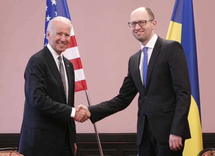 U.S. Vice President Joe Biden (L) shakes hands with Ukraine's Prime Minister Arseny Yatseniuk during a meeting in Kiev,