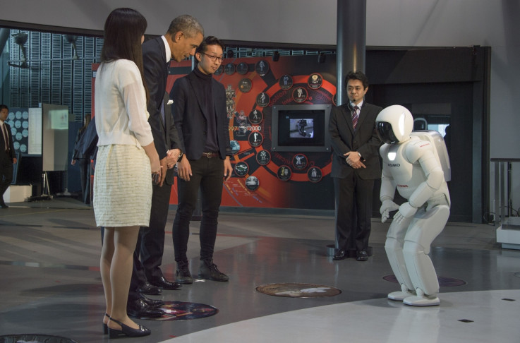 President Obama bows to Honda's humanoid robot ASIMO
