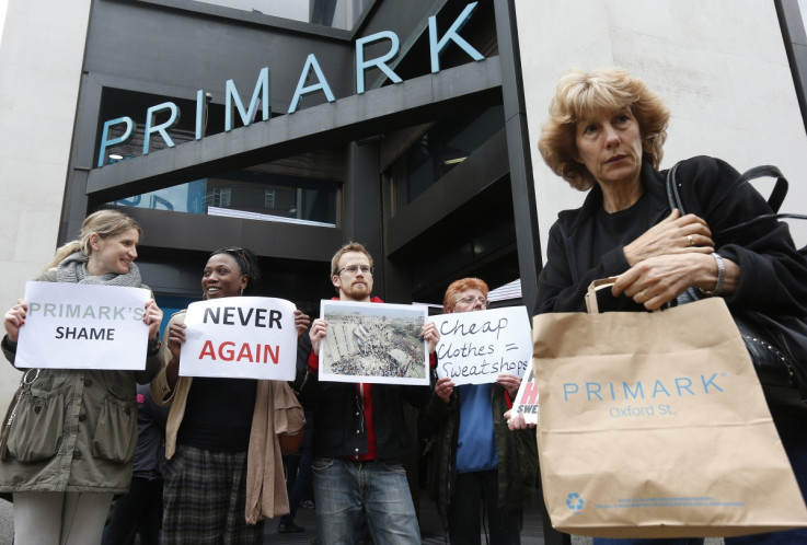 Post Rana Plaza: A shopper passes demonstrators outside clothing retailer Primark in central London April 27, 2013.