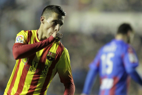 Barcelona's Cristian Tello celebrates after he scored against Levante during their Spanish King's Cup quarter-final first leg soccer match at the Ciudad de Valencia stadium in Valencia, January 22, 2014.