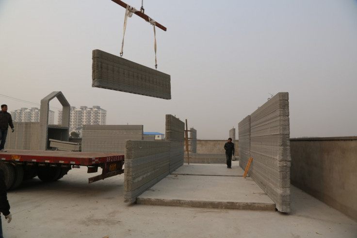 A 3D-printed house being built using a material made from construction waste mixed with cement
