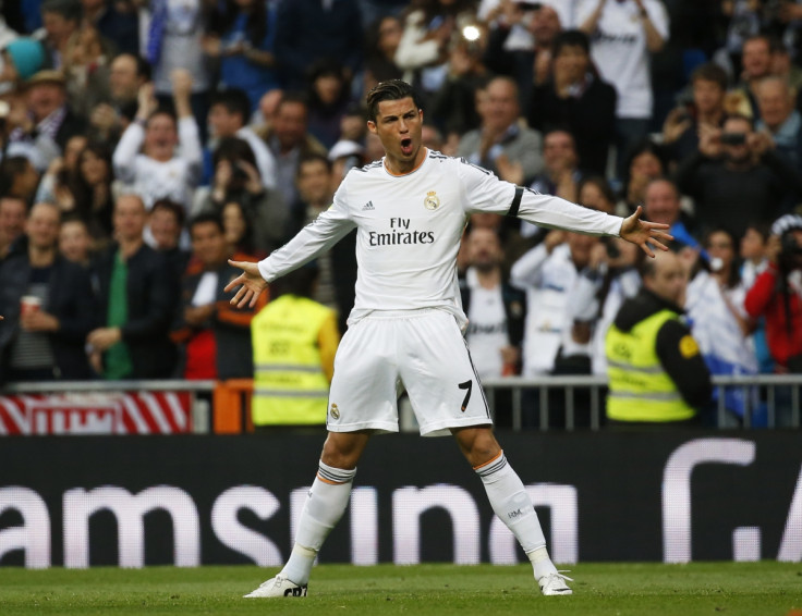 Real Madrid's Cristiano Ronaldo celebrates his goal against Osasuna during their Spanish First Division soccer match at Santiago Bernabeu stadium in Madrid April 26, 2014.