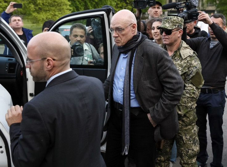 Officials from the OSCE special mission in Ukraine leave the mayor's office in Sloviansk