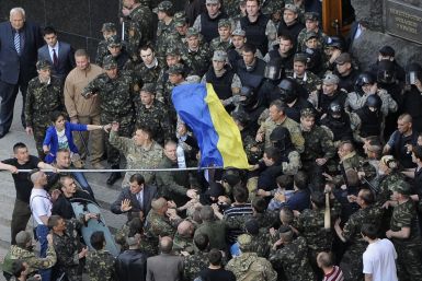 Members of Ukraine's State Security Administration (top) clash with members of the Euromaidan movement's self-defence units during a rally in Kiev