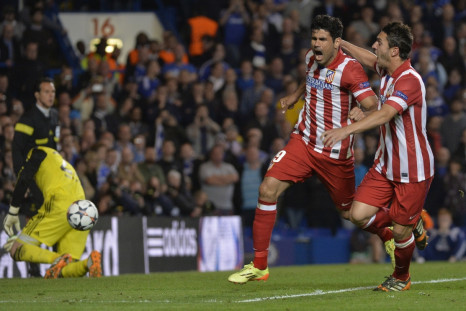Atletico Madrid's Diego Costa celebrates with Koke (R) after scoring a penalty goal against Chelsea during their Champion's League semi-final second leg soccer match at Stamford Bridge in London April 30, 2014.