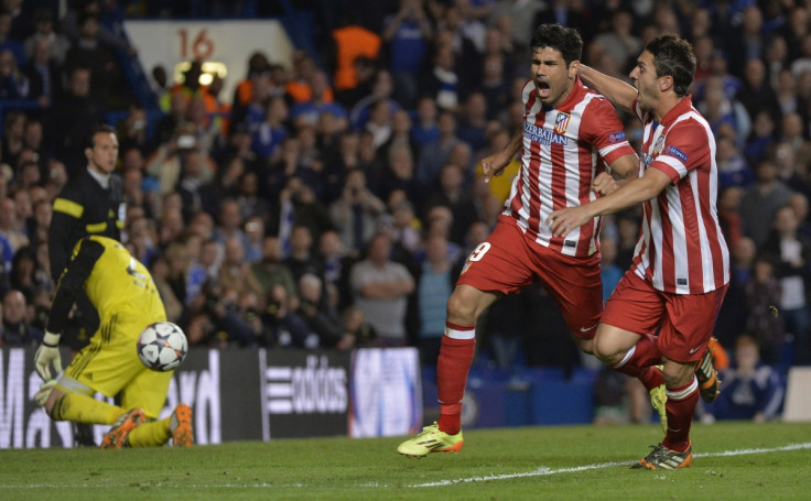 Atletico Madrid's Diego Costa celebrates with Koke (R) after scoring a penalty goal against Chelsea during their Champion's League semi-final second leg soccer match at Stamford Bridge in London April 30, 2014.