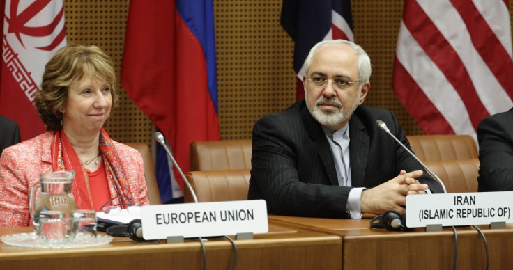 European Union foreign policy chief Catherine Ashton (L) and Iranian Foreign Minister Mohammad Javad Zarif wait for the start of talks in Vienna