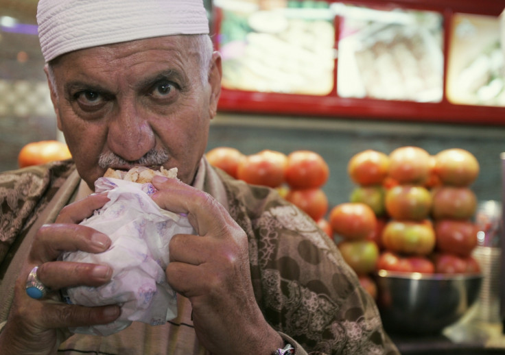 A Lebanese man eats a falafel sandwich at a restaurant in Beirut