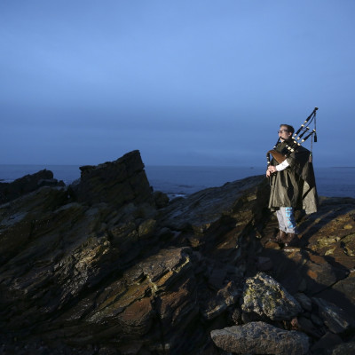 Piper Danny Hutcheson, 16, poses for a photograph on the coastline of Fraserburgh in Aberdeenshire, Scotland March 6, 2014. Danny will vote "No" in the referendum because he is unsure what would happen with a "Yes" vote.