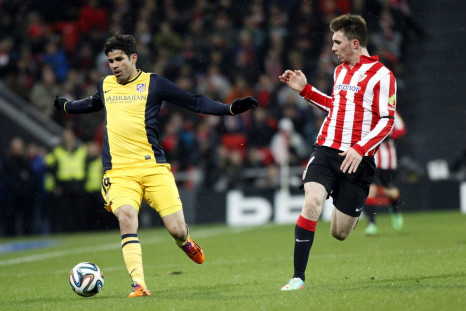 Atletico Madrid's Diego Costa (L) fights for the ball with Athletic Bilbao's Aymeric Laporte during their Spanish King's Cup soccer match at San Mames stadium in Bilbao January 29, 2014.