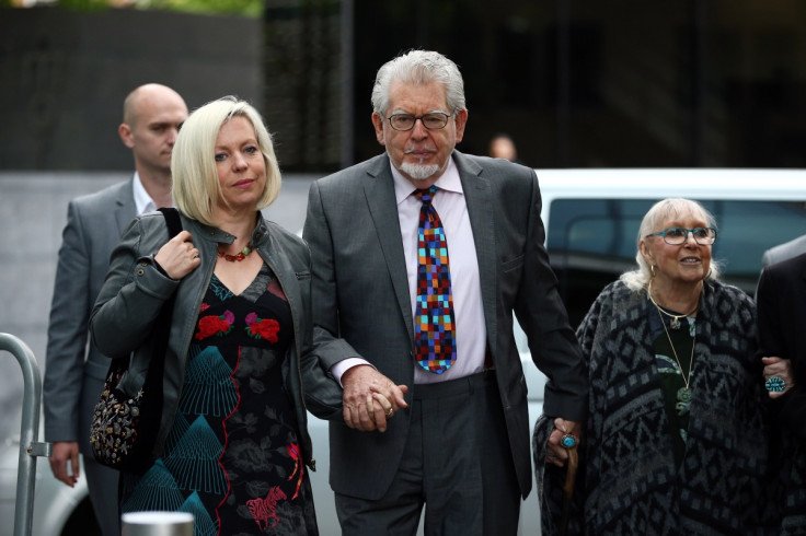 Rolf Harris arrives for his sex crimes trial with his daughter Bindi (l) and wife Alwen Hughes