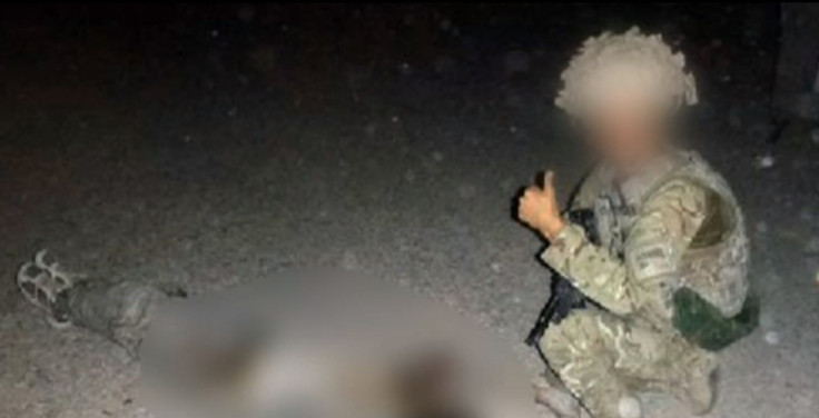 RAF serviceman posing with dead Taliban