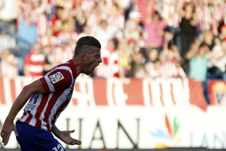 Atletico Madrid's Toby Alderweireld celebrates after scoring a goal against Malaga during their Spanish first division soccer match at Vicente Calderon stadium in Madrid May 11, 2014.