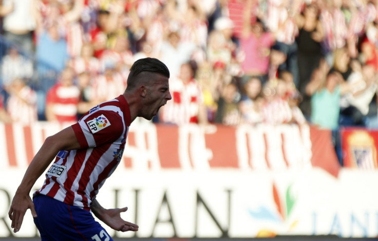 Atletico Madrid's Toby Alderweireld celebrates after scoring a goal against Malaga during their Spanish first division soccer match at Vicente Calderon stadium in Madrid May 11, 2014.