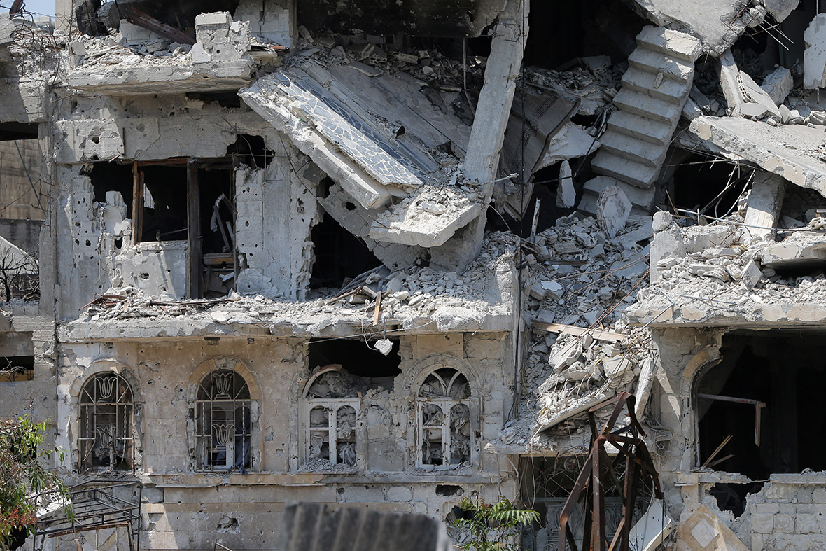 A heavily damaged building in a destroyed neighbourhood of the Old City of Homs