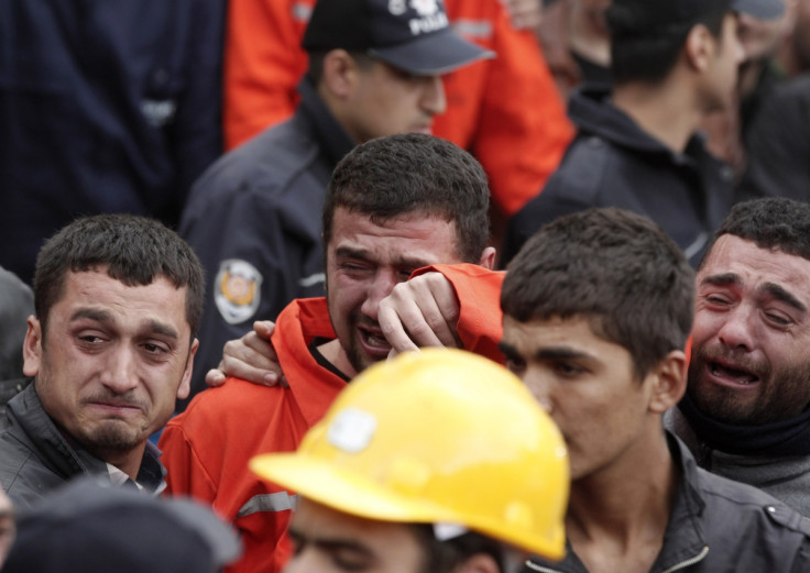 Relatives of miners who were killed or injured in a mine explosion react as rescuers work in Soma, a district in Turkey's western province of Manisa