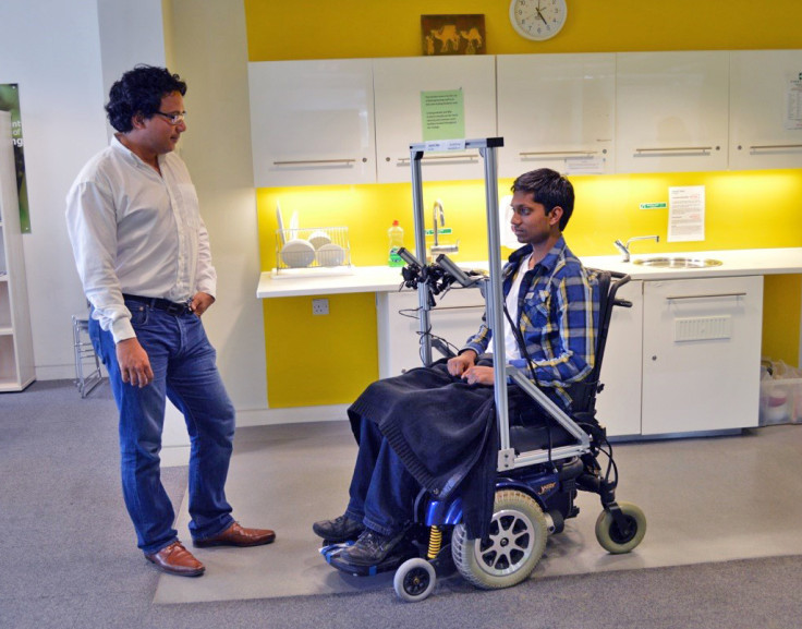 Dr Aldo Faisal (left) and Kirubin Pillay demonstrate hands-free wheelchair driving using a prototype that cost £20