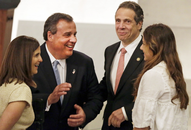 New Jersey Governor Chris Christie (2nd L), with his wife Mary Pat Christie (L), and New York Governor Andrew Cuomo and his daughter Michaela Cuomo (R), meet during the dedication ceremony in Foundation Hall, of the National September 11 Memorial Museum