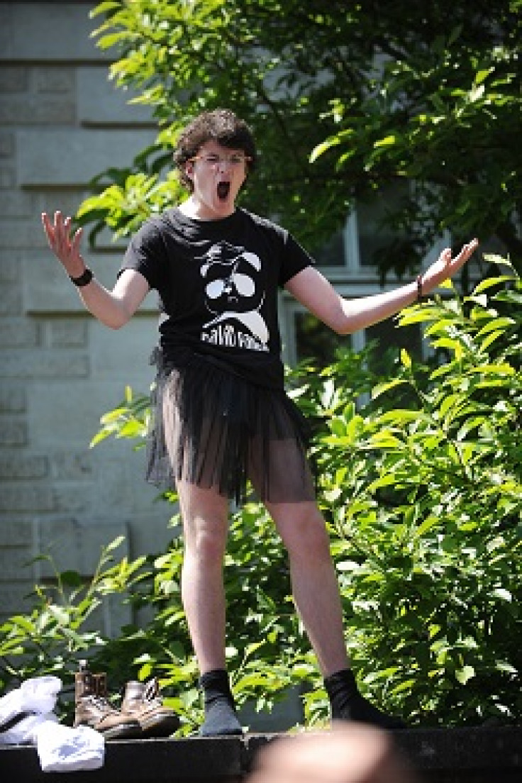 Student wearing a skirt faces anti-gay marriage protesters of 'La Manif pour tous'