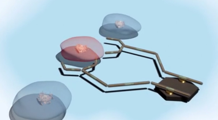 An illustration of a nanobot targeting a cancer cell for treatment