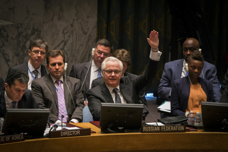 Russia's UN Ambassador Vitaly Churkin votes in the United Nations Security Council against referring the Syrian crisis to the International Criminal Court for investigation of possible war crimes