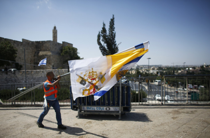 The Vatican flag is hung just outside Jerusalem's Old City in preparation for Pope Francis' visit, his first to the region