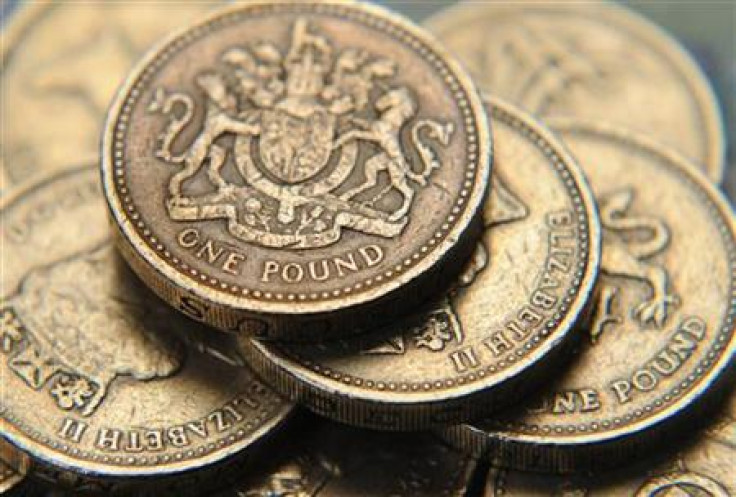 A pile of one pound coins is seen in central London
