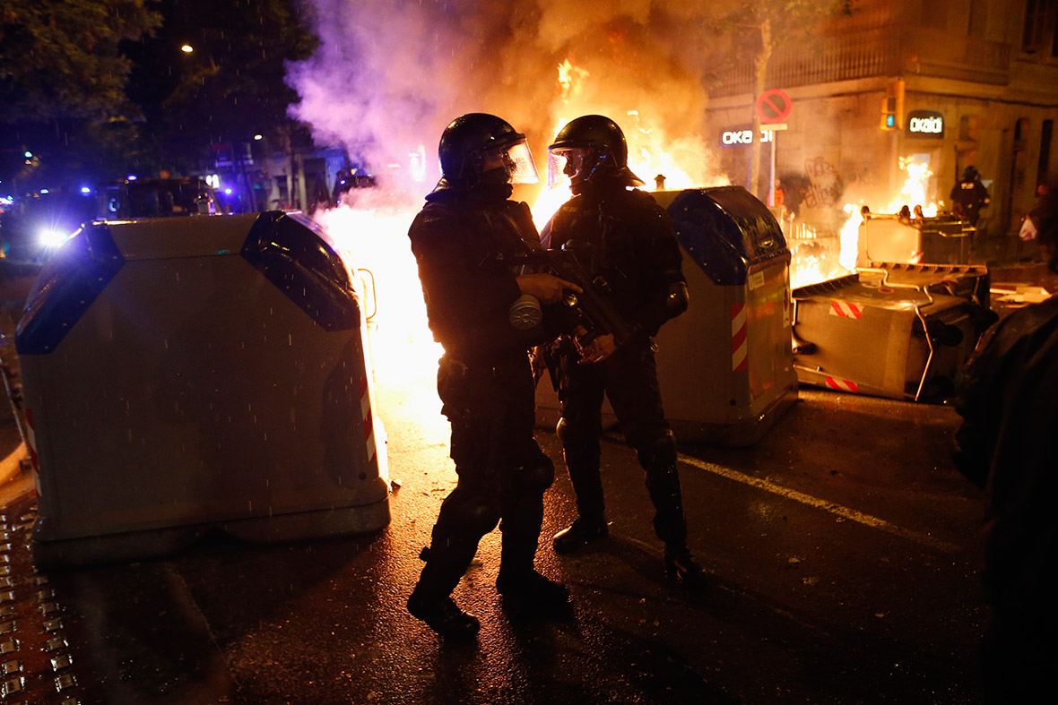 Barcelona can vies police flames