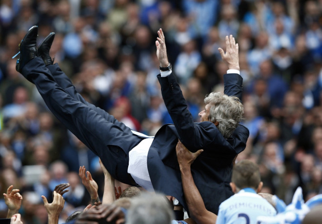 Manchester City's manager Manuel Pellegrini is thrown into the air by his team as they celebrate winning the English Premier League trophy following their soccer match against West Ham United at the Etihad Stadium in Manchester, northern England May 11, Manchester City's manager Manuel Pellegrini is thrown into the air by his team as they celebrate winning the English Premier League trophy following their soccer match against West Ham United at the Etihad Stadium in Manchester, northern England May 11,