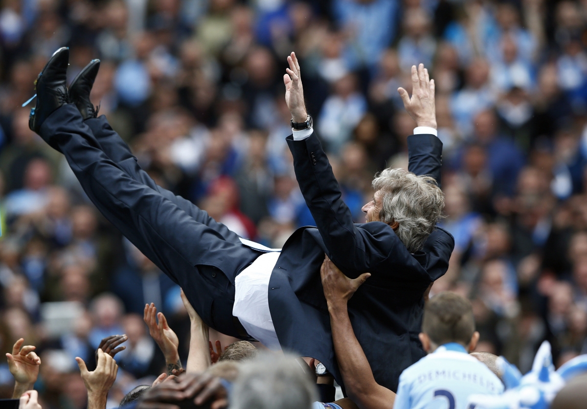 Manchester City's manager Manuel Pellegrini is thrown into the air by his team as they celebrate winning the English Premier League trophy following their soccer match against West Ham United at the Etihad Stadium in Manchester, northern England May 11, Manchester City's manager Manuel Pellegrini is thrown into the air by his team as they celebrate winning the English Premier League trophy following their soccer match against West Ham United at the Etihad Stadium in Manchester, northern England May 11,