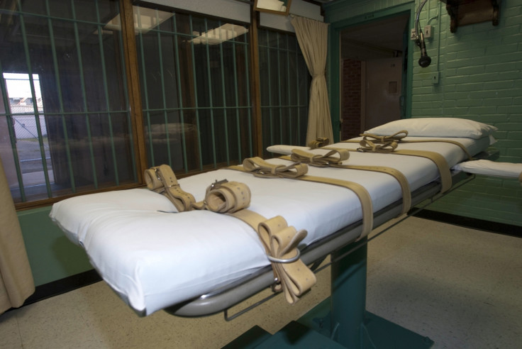 The death chamber and the steel bars of the viewing room are seen at the federal penitentiary in Huntsville, Texas