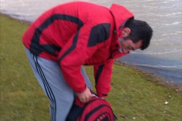 Hasan Fidan stuffs royal swan in to a bag to enjoy later in scenes caught on camera in Kent