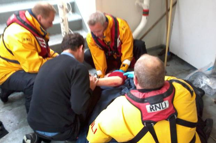 RNLI rescuers treat victim after boat hit Tower Bridge