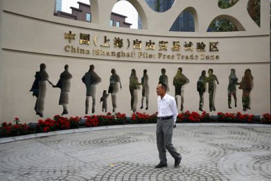 A man walks at the entrance of the new Shanghai Free Trade Zone in Pudong district, Shanghai