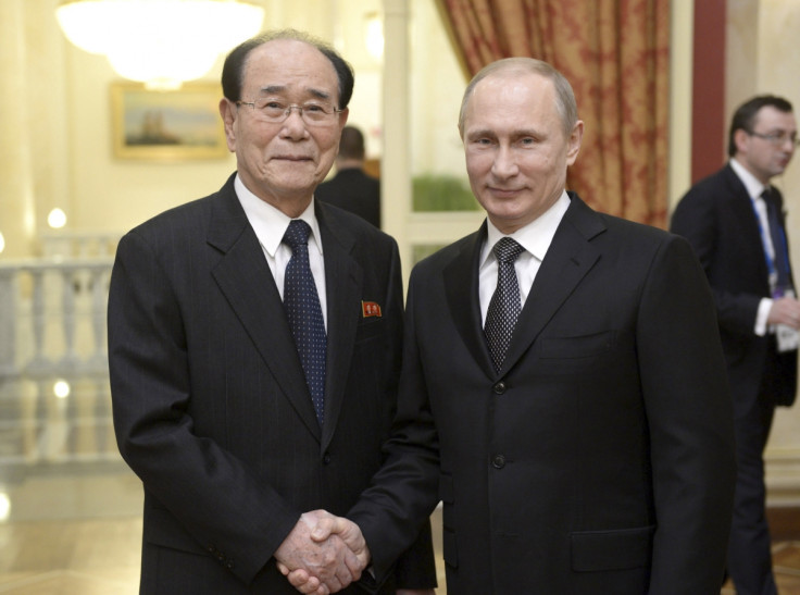 Vladimir Putin meets a North Korean official.