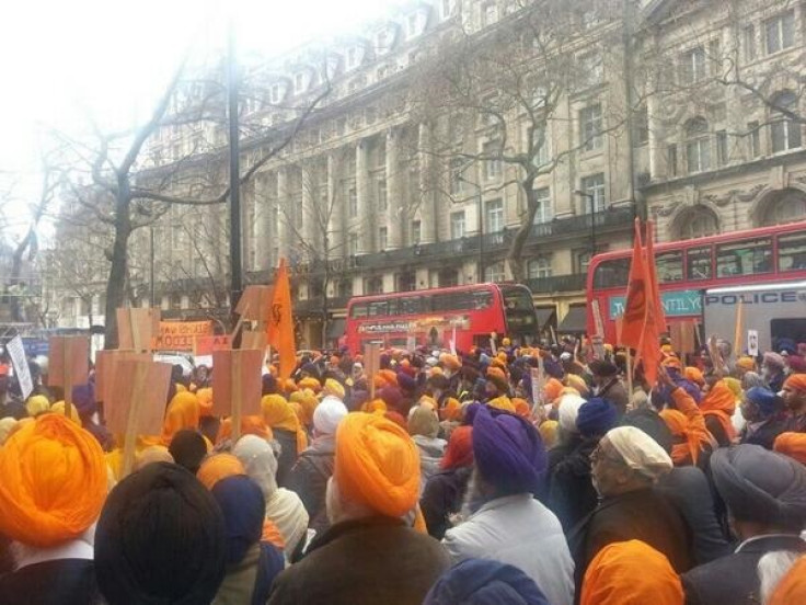 Scores of Sikh demonstrators marching through central London.
